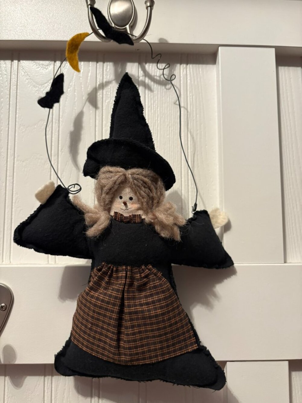 Stuffed black witch with wire hanger, 14" from hanger to hem